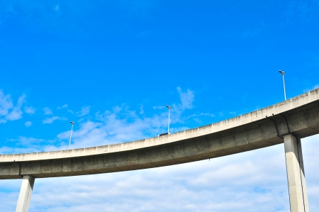  Detail of a suspension bridge with clouds on the right の写真素材