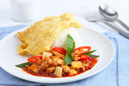 Clams in Chili paste and fried omelet topped on riceの写真素材