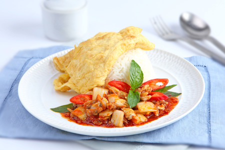 Clams in Chili paste and fried omelet topped on rice の写真素材