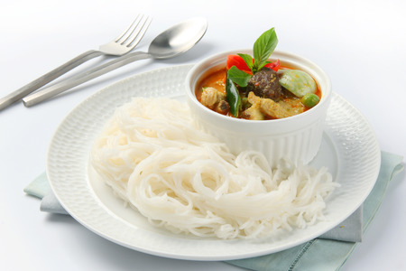 thai style noodle with vegetable and curryの写真素材