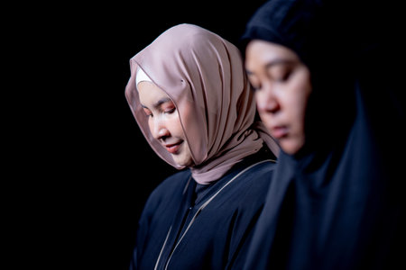 Many groups of Asian Muslim women in the Islamic religion in hijabs of cream and black color. She...