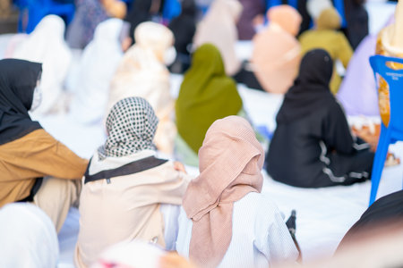 Many Muslims, children, women, and men pray and celebrate Eid al-Fitr which marks the end of the month of Ramadan, they are happy, in Thailand.の写真素材