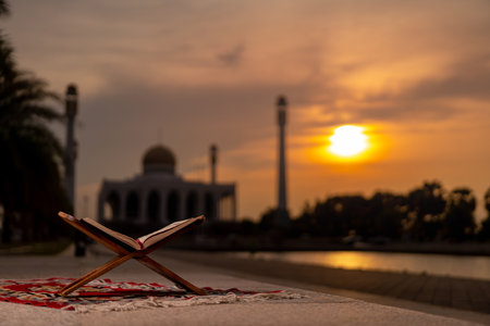 Islamic concept - The Holy Al Quran with written Arabic calligraphy meaning of Al Quran and rosary beads or tasbih, Arabic word translation: The Holy Al Quran (holy book of Muslim)の写真素材
