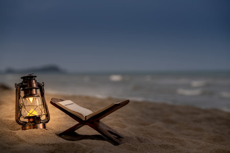 Ramadan Kareem with the Holy Quran. The Koran on the beach is cool and peaceful.の写真素材