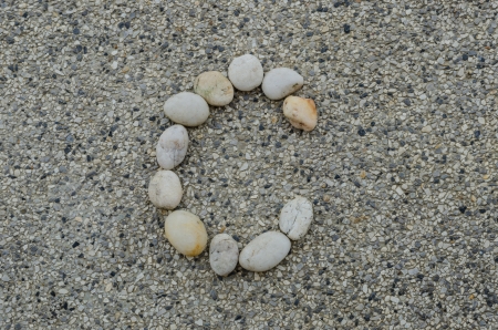 C - Letter alphabet stones laid out on the graniteの写真素材