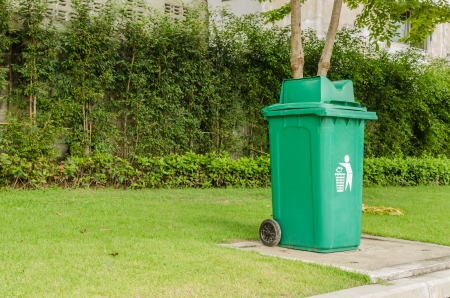 Green garbage, trash bin at parkの写真素材