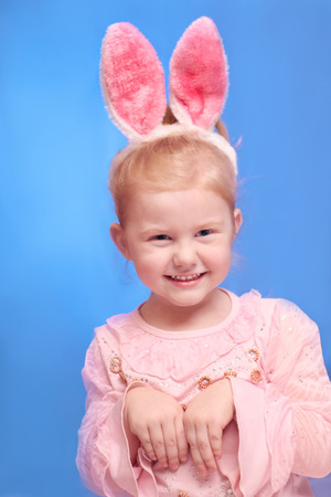 little girl wearing Easter bunny ears on headの写真素材