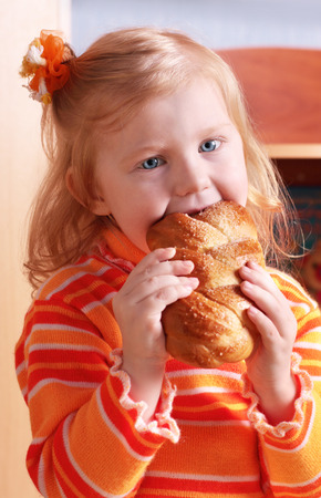 little girl with foodの写真素材