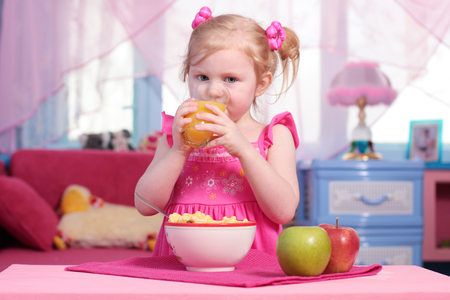 little girl with foodの写真素材