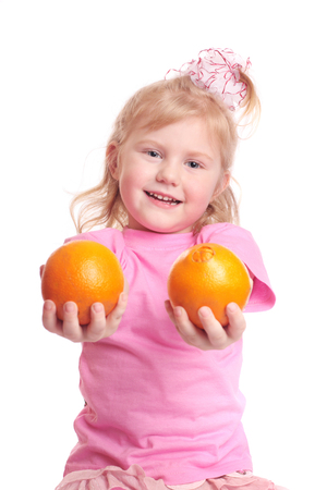girl with orange isolated on whiteの写真素材