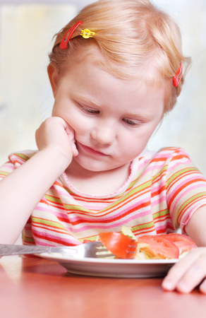 little girl with saladの写真素材