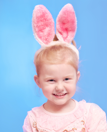 smile  girl wearing Easter bunny ears on headの写真素材