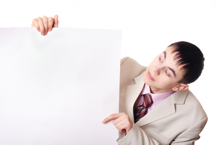 Handsome Businessman holding a blank sign in front of himの写真素材