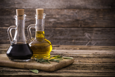 olive oil and balsamic vinegar on a wooden backgroundの写真素材