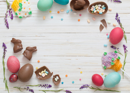 Easter Eggs Over Blue Wooden Backgroundの写真素材