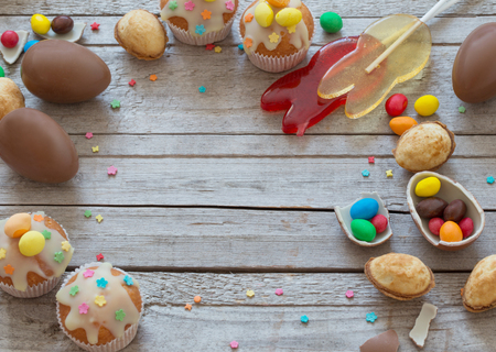 Chocolate Easter Eggs and Cake Over Wooden Backgroundの写真素材