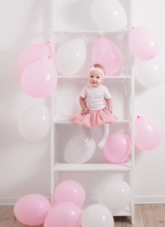 beautiful little girl with balloonsの写真素材