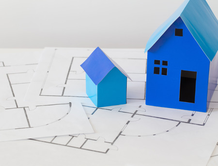 blue paper houses on wooden tableの写真素材