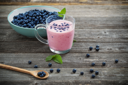 blueberries on old wooden backgroundの写真素材