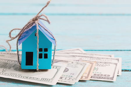 House from the paper and money on wooden backgroundの写真素材