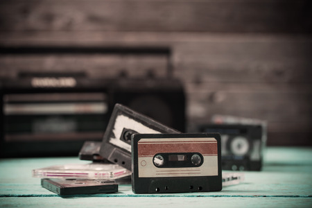 old cassette tape and player on the wood backgroundの写真素材