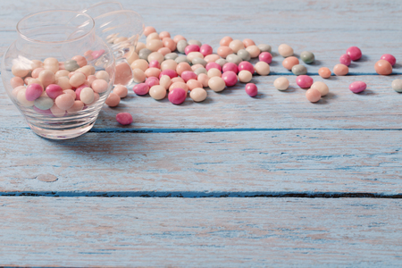 candies on a wooden backgroundの写真素材