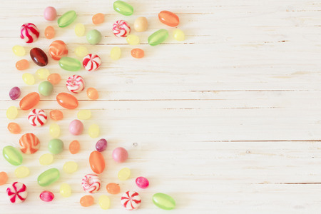 variety of candies on a wooden backgroundの写真素材
