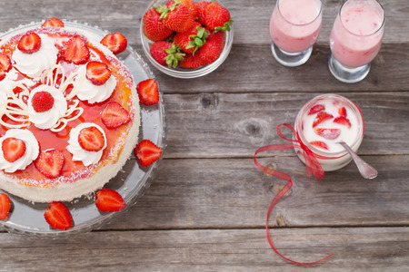 cake with strawberries on wooden tableの写真素材