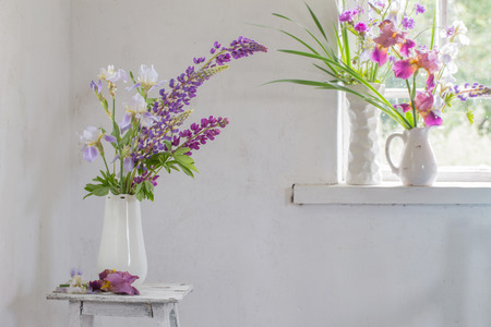 Flower vase sitting inside of windowの写真素材