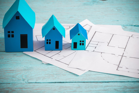 blue paper houses on wooden tableの写真素材