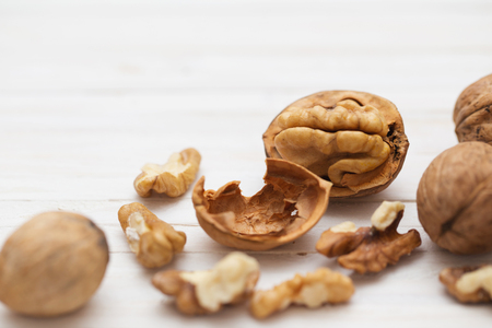 walnuts on white wooden backgroundの写真素材