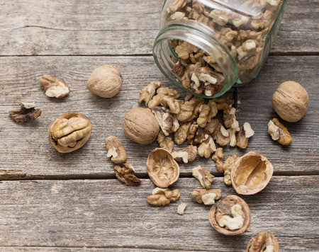 walnuts on rustic old wooden tableの写真素材