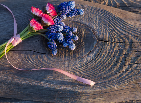 pink and blue bouquet on wooden backgroundの写真素材