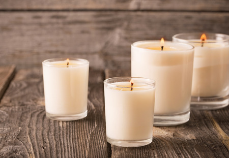 scented candles on old wooden backgroundの写真素材