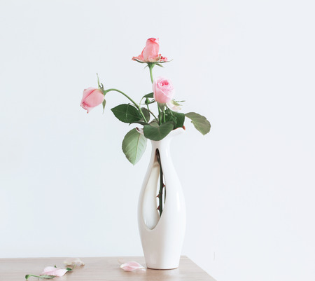 still life of pink rose in ceramic vaseの写真素材