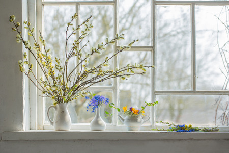 bouquet of flowers on the windowsillの写真素材