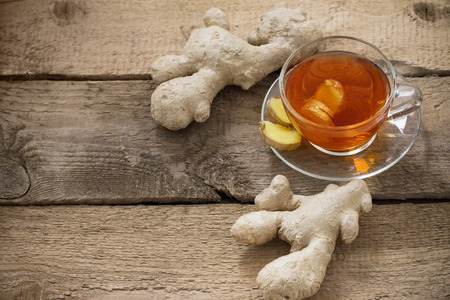 Ginger tea on wooden backgroundの写真素材