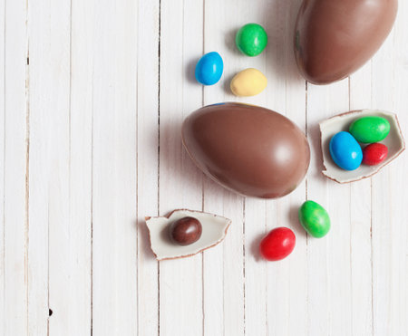 Chocolate Easter Eggs Over Wooden Background
