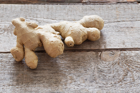 Ginger on wooden backgroundの写真素材