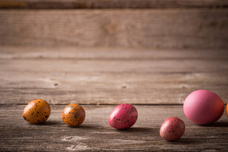 Easter eggs on wooden backgroundの写真素材