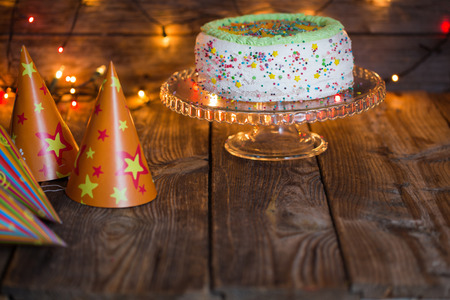 birthday cake on wooden table on light backgroundの写真素材