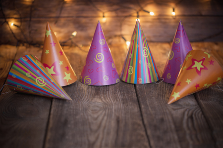 party hats on old wooden  backgroundの写真素材