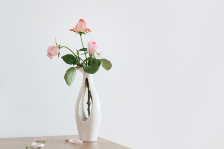 still life of pink rose in ceramic vaseの写真素材