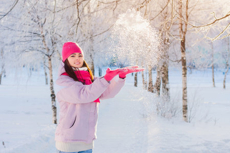 happy beautiful girl in winter parkの写真素材