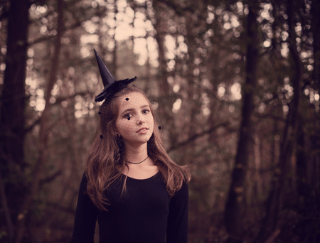 young witch in forestの写真素材