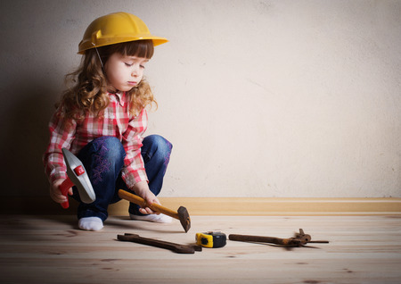 little girl plays in the builderの写真素材