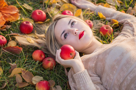 Girl with the apples outdoorの写真素材