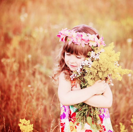 beautiful girl hugging a bouquetの写真素材