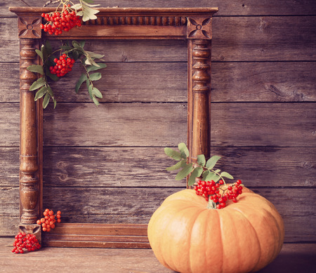 wooden background with pumpkinの写真素材