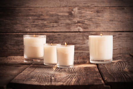 scented candles on old wooden backgroundの写真素材